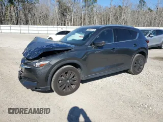 2021 Mazda CX-5 Signature with VIN JM3KFBEY2M0437304, listed as a Copart auction lot 88841415 with 57,100 mi miles and Salvage Title. Bid and sale history available at carsss.com. Image 1.