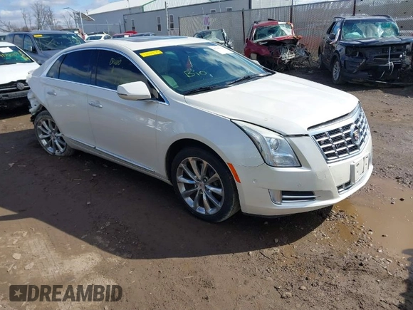 2014 Cadillac XTS Premium with VIN 2G61P5S38E9124277, listed as a IAAI auction lot 41744734 with 136,223 mi miles. Bid and sale history available at carsss.com. Image 1.