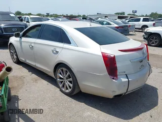 2013 Cadillac XTS Premium z VIN 2G61S5S33D9235025, wystawiony jako IAAI lot #42288742 z przebiegiem 180 221 mil mil oraz . Historia ofert i sprzedaży dostępna na DreamBid. Obrazek 3.