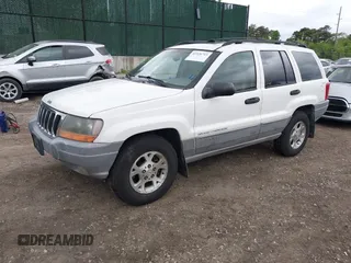 2000 Jeep Grand Cherokee Laredo z VIN 1J4GW48S2YC390226, wystawiony jako IAAI lot #42326715 z przebiegiem 273 806 mil mil oraz . Historia ofert i sprzedaży dostępna na DreamBid. Obrazek 2.