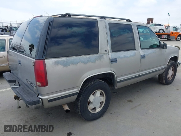 1999 Chevrolet Tahoe Z71 with VIN 1GNEK13R4XJ504675, listed as a IAAI auction lot 42162102 with 320,128 mi miles and . Bid and sale history available at DreamBid. Image 4.