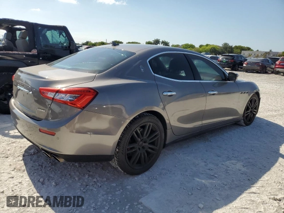 2014 Maserati Ghibli S Q4 z VIN ZAM57RTA6E1090293, wystawiony jako Copart lot #57298875 z przebiegiem 113 805 mil mil oraz Tytuł czysty. Historia ofert i sprzedaży dostępna na DreamBid. Obrazek 3.