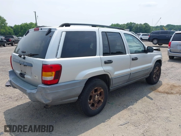 2002 Jeep Grand Cherokee Laredo with VIN 1J4GW48SX2C313093, listed as a IAAI auction lot 42446559 with 200,319 mi miles and . Bid and sale history available at DreamBid. Image 4.