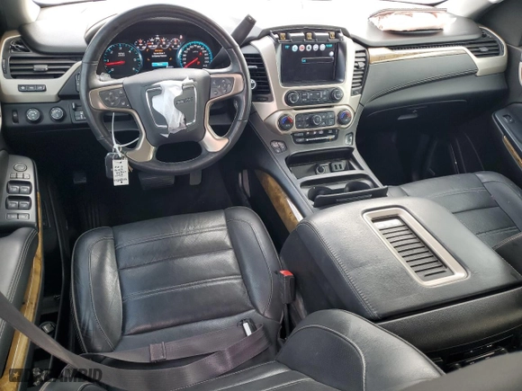 2017 GMC Yukon Denali with VIN 1GKS2CKJ1HR202917, listed as a Copart auction lot 77452134 with 110,640 mi miles and Salvage Title. Bid and sale history available at carsss.com. Image 8.