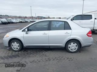 2007 Nissan Versa 1.8 SL with VIN 3N1BC11E97L447829, listed as a IAAI auction lot 41612386 with 123,500 mi miles. Bid and sale history available at carsss.com. Image 14.