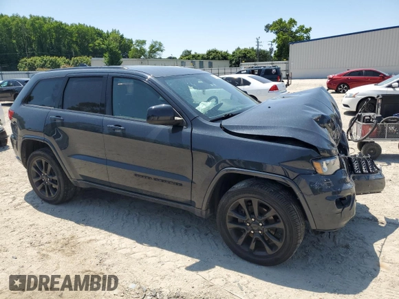 2018 Jeep Grand Cherokee Altitude with VIN 1C4RJFAGXJC267021, listed as a Copart auction lot 58762945 with 93,347 mi miles and Salvage title. Bid and sale history available at DreamBid. Image 4.