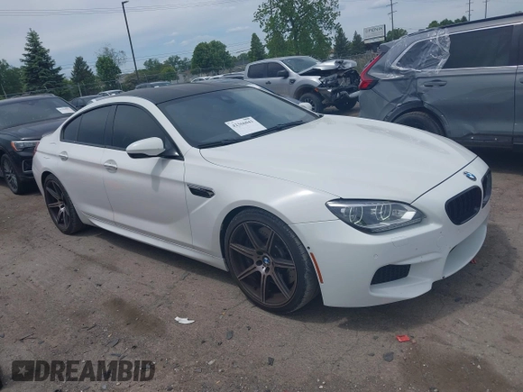 2015 BMW M6 z VIN WBS6C9C50FD467538, wystawiony jako IAAI lot #42366043 z przebiegiem 66 379 mil mil oraz . Historia ofert i sprzedaży dostępna na DreamBid. Obrazek 1.