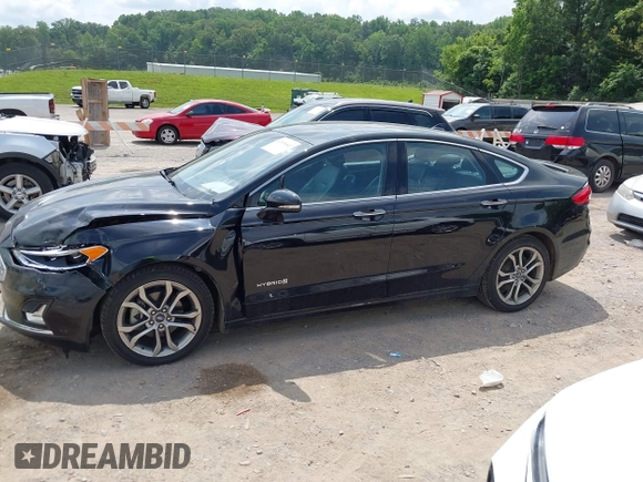 2019 Ford Fusion Titanium z VIN 3FA6P0RU0KR260239, wystawiony jako IAAI lot #42436643 z przebiegiem 114 631 mil mil oraz . Historia ofert i sprzedaży dostępna na DreamBid. Obrazek 14.