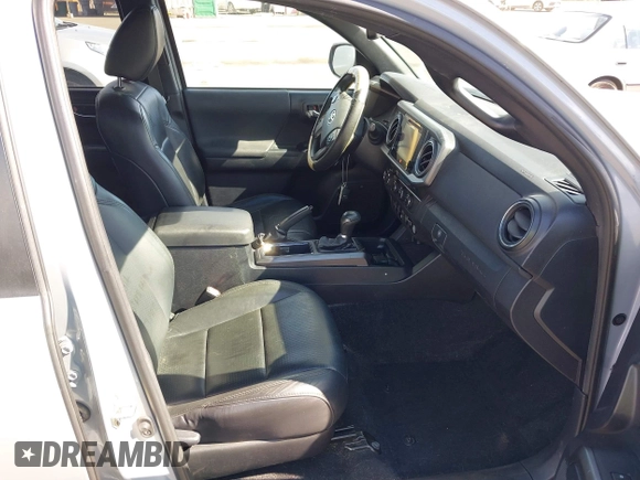 2019 Toyota Tacoma SR with VIN 3TMCZ5AN7KM213537, listed as a IAAI auction lot 42442068 with 39,969 mi miles and . Bid and sale history available at DreamBid. Image 5.