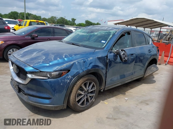 2018 Mazda CX-5 Touring z VIN JM3KFACM5J1442416, wystawiony jako IAAI lot #42093137 z przebiegiem 65 102 mil mil oraz . Historia ofert i sprzedaży dostępna na DreamBid. Obrazek 2.