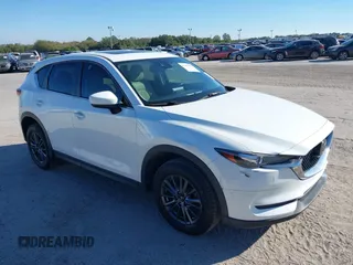 2020 Mazda CX-5 Touring with VIN JM3KFACM6L0737727, listed as a IAAI auction lot 41283200 with 85,949 mi miles and . Bid and sale history available at carsss.com. Image 1.