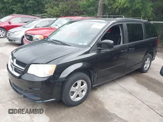 2013 Dodge Grand Caravan SXT with VIN 2C4RDGCG0DR552784, listed as a IAAI auction lot 42116395 with 96,917 mi miles and . Bid and sale history available at DreamBid. Image 2.