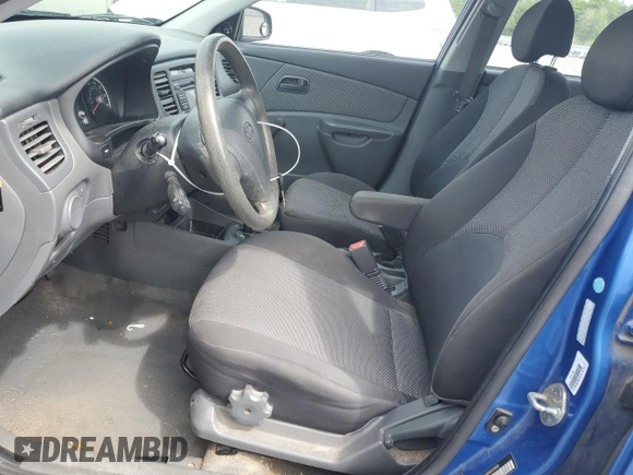 2009 Kia Rio LX with VIN KNADE223696530633, listed as a Copart auction lot 68371794 with 165,505 mi miles and Salvage Title. Bid and sale history available at DreamBid. Image 7.
