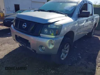2010 Nissan Titan XE with VIN 1N6AA0EJ4AN311838, listed as a IAAI auction lot 41789366 with 208,900 mi miles. Bid and sale history available at carsss.com. Image 2.