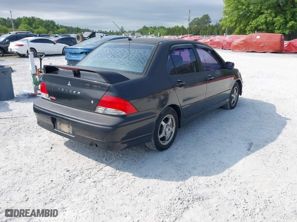 2002 Mitsubishi Lancer OZ-Rally with VIN JA3AJ86E22U074890, listed as a IAAI auction lot 42029591 with 235,818 mi miles. Bid and sale history available at carsss.com. Image 4.
