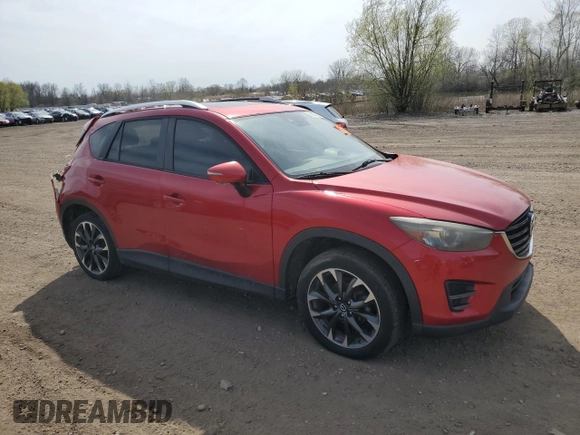 2016 Mazda CX-5 Grand Touring z VIN JM3KE2DY2G0705650, wystawiony jako Copart lot #53808365 z przebiegiem 123 611 mil mil oraz Szkoda całkowita • Salvage title. Historia ofert i sprzedaży dostępna na DreamBid. Obrazek 4.