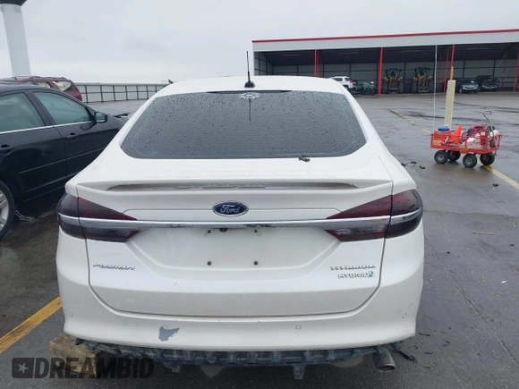 2017 Ford Fusion Hybrid Titanium с VIN 3FA6P0RUXHR317572, выставлен на аукционе IAAI как лот 42170169 с пробегом 138 987 миль миль и . История ставок и продаж доступна на DreamBid. Изображение 16.