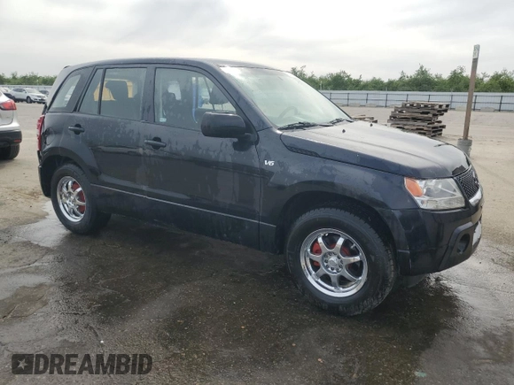 2007 Suzuki Grand Vitara with VIN JS3TE941474202110, listed as a Copart auction lot 52110865 with 132,661 mi miles and Salvage title. Bid and sale history available at DreamBid. Image 4.