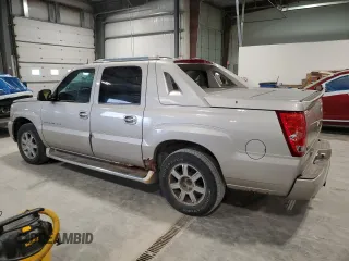 2004 Cadillac Escalade EXT z VIN 3GYEK62NX4G273082, wystawiony jako Copart lot #54826215 z przebiegiem 251 075 mil mil oraz Szkody całkowita. Historia ofert i sprzedaży dostępna na DreamBid. Obrazek 2.