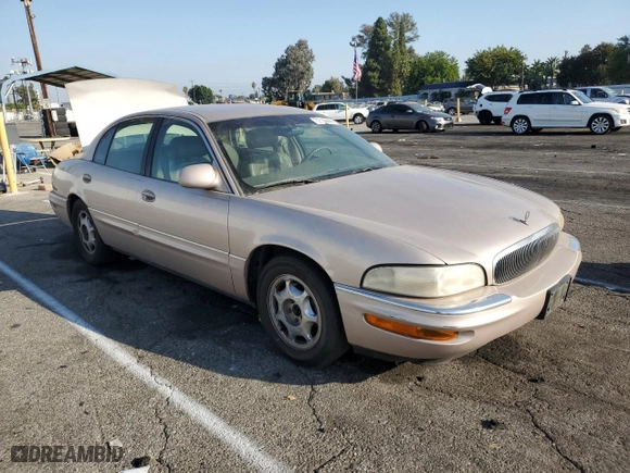 1999 Buick Park Avenue with VIN 1G4CW52K6X4653731, listed as a Copart auction lot 72736444 with 128,471 mi miles and Salvage Title. Bid and sale history available at carsss.com. Image 4.