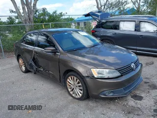 2012 Volkswagen Jetta Sedan SEL w/Sunroof with VIN 3VWLX7AJ9CM409833, listed as a IAAI auction lot 42008181 with 185,803 mi miles. Bid and sale history available at carsss.com. Image 1.