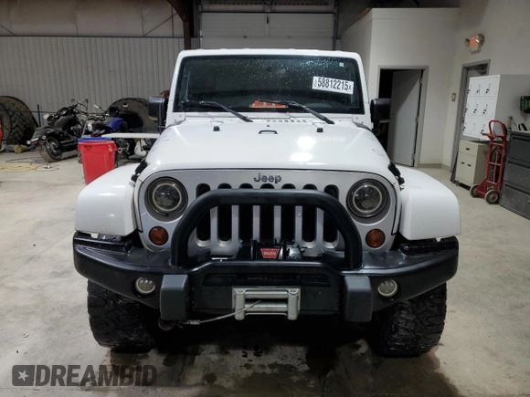2008 Jeep Wrangler Unlimited Sahara с VIN 1J8GA59108L514034, выставлен на аукционе Copart как лот 58812215 с пробегом 191 800 миль миль и Списание • Salvage title. История ставок и продаж доступна на DreamBid. Изображение 5.