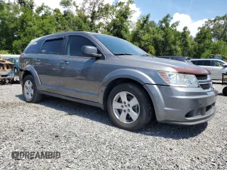 2013 Dodge Journey American Value with VIN 3C4PDCAB8DT566999, listed as a Copart auction lot 61361315 with 183,897 mi miles and Salvage title. Bid and sale history available at DreamBid. Image 4.