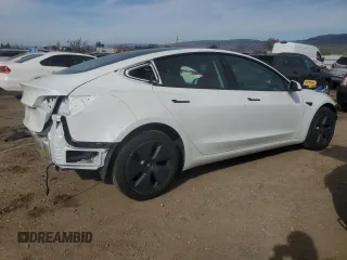 2023 Tesla Model 3 with VIN 5YJ3E1EA9PF546149, listed as a Copart auction lot 52104365 with 34,105 mi miles and Salvage Title. Bid and sale history available at DreamBid. Image 3.