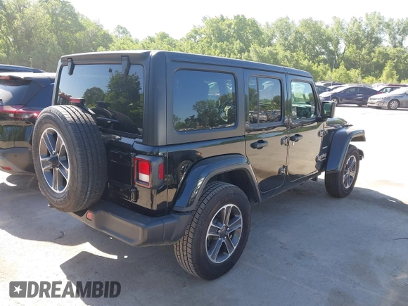 2023 Jeep Wrangler Sahara with VIN 1C4HJXEN5PW702268, listed as a IAAI auction lot 42288704 with 57,240 mi miles and . Bid and sale history available at DreamBid. Image 4.