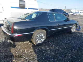 1999 Cadillac Eldorado Touring z VIN 1G6ET129XXU603042, wystawiony jako IAAI lot #41699955 z przebiegiem 81 704 mil mil oraz . Historia ofert i sprzedaży dostępna na DreamBid. Obrazek 4.