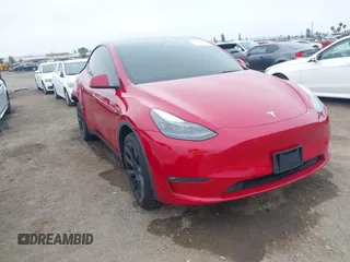 2022 Tesla Model Y Long Range z VIN 7SAYGDEE6NF516661, wystawiony jako IAAI lot #42432990 z przebiegiem 136 668 mil mil oraz . Historia ofert i sprzedaży dostępna na DreamBid. Obrazek 1.