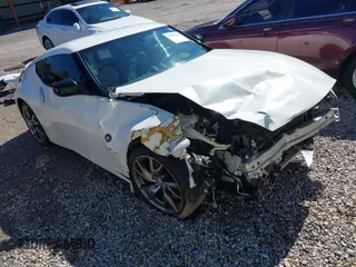 2013 Nissan 370Z z VIN JN1AZ4EH1DM880921, wystawiony jako IAAI lot #41646126 z przebiegiem Nie podano mil oraz . Historia ofert i sprzedaży dostępna na DreamBid. Obrazek 1.