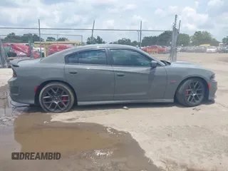 2019 Dodge Charger Scat Pack with VIN 2C3CDXGJ2KH633854, listed as a IAAI auction lot 42212517 with 74,285 mi miles and . Bid and sale history available at DreamBid. Image 13.