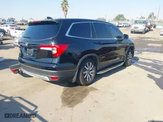 2019 Honda Pilot EX-L with VIN 5FNYF5H50KB042851, listed as a IAAI auction lot 41297072 with 101,796 mi miles. Bid and sale history available at carsss.com. Image 4.