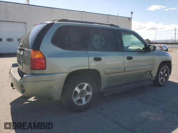 2004 GMC Envoy SLE with VIN 1GKDS13S442417232, listed as a Copart auction lot 51821225 with 242,945 mi miles and Salvage Title. Bid and sale history available at carsss.com. Image 3.