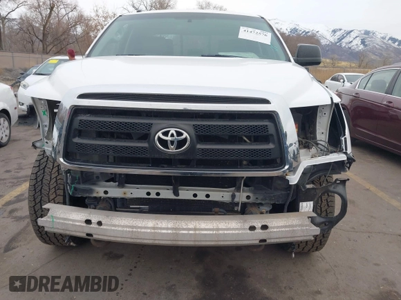 2012 Toyota Tundra z VIN 5TFUM5F11CX039386, wystawiony jako IAAI lot #41472576 z przebiegiem 213 295 mil mil oraz . Historia ofert i sprzedaży dostępna na DreamBid. Obrazek 6.