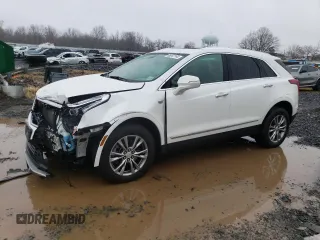 2022 Cadillac XT5 AWD Premium Luxury with VIN 1GYKNDRS7NZ132868, listed as a Copart auction lot 85047164 with 67,585 mi miles and Salvage title. Bid and sale history available at DreamBid. Image 1.
