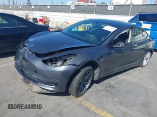 2022 Tesla Model 3 with VIN 5YJ3E1EA1NF142713, listed as a IAAI auction lot 42027630 with 112,557 mi miles. Bid and sale history available at carsss.com. Image 2.
