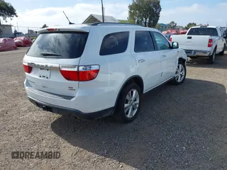 2013 Dodge Durango Crew with VIN 1C4SDHDT2DC679600, listed as a IAAI auction lot 42215737 with 128,499 mi miles and . Bid and sale history available at DreamBid. Image 4.