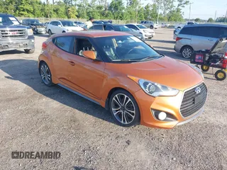2016 Hyundai Veloster Turbo z VIN KMHTC6AE4GU255699, wystawiony jako IAAI lot #42870014 z przebiegiem 186 077 mil mil oraz . Historia ofert i sprzedaży dostępna na DreamBid. Obrazek 1.