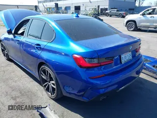 2020 BMW 3 Series 330i with VIN WBA5R1C06LFH38996, listed as a IAAI auction lot 41664442 with Not Provided miles and . Bid and sale history available at carsss.com. Image 3.