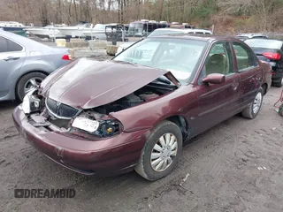 2000 Mercury Mystique GS z VIN 1MEFM6533YK613961, wystawiony jako IAAI lot #41982995 z przebiegiem 83 174 mil mil oraz . Historia ofert i sprzedaży dostępna na DreamBid. Obrazek 2.