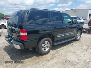 2003 Chevrolet Tahoe LS with VIN 1GNEC13V03R315463, listed as a IAAI auction lot 42518427 with 155,629 mi miles and . Bid and sale history available at DreamBid. Image 4.