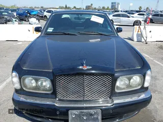 2001 Bentley Arnage with VIN SCBLC31E11CX06297, listed as a IAAI auction lot 41980275 with 63,510 mi miles and . Bid and sale history available at DreamBid. Image 12.