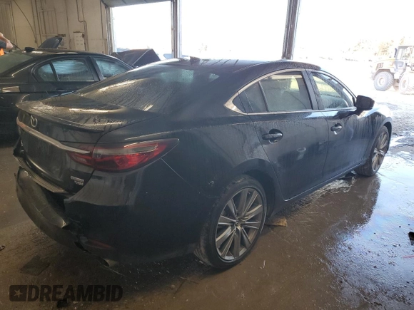 2021 Mazda 6 Carbon Edition with VIN JM1GL1WY9M1605756, listed as a Copart auction lot 46778355 with 60,063 mi miles and Salvage Title. Bid and sale history available at DreamBid. Image 3.