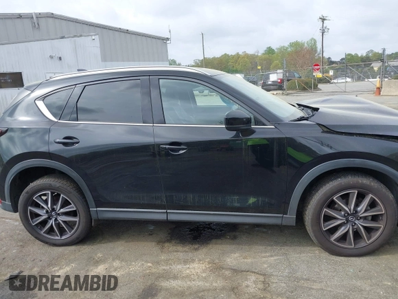 2018 Mazda CX-5 Grand Touring with VIN JM3KFBDM1J0358197, listed as a IAAI auction lot 41967940 with 148,119 mi miles and . Bid and sale history available at DreamBid. Image 13.