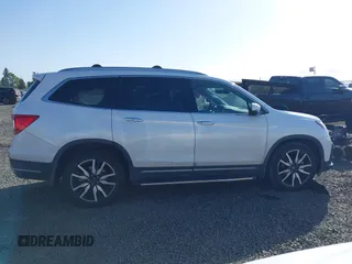 2021 Honda Pilot Touring 8-Passenger with VIN 5FNYF6H92MB031782, listed as a IAAI auction lot 42087322 with 70,062 mi miles and . Bid and sale history available at DreamBid. Image 13.