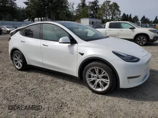 2020 Tesla Model Y Long Range with VIN 5YJYGDEF2LF006357, listed as a Copart auction lot 54888215 with 55,983 mi miles and Salvage Title. Bid and sale history available at DreamBid. Image 4.