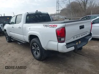 2018 Toyota Tacoma SR5 with VIN 3TMDZ5BN9JM051105, listed as a IAAI auction lot 41708034 with 98,000 mi miles and . Bid and sale history available at DreamBid. Image 3.