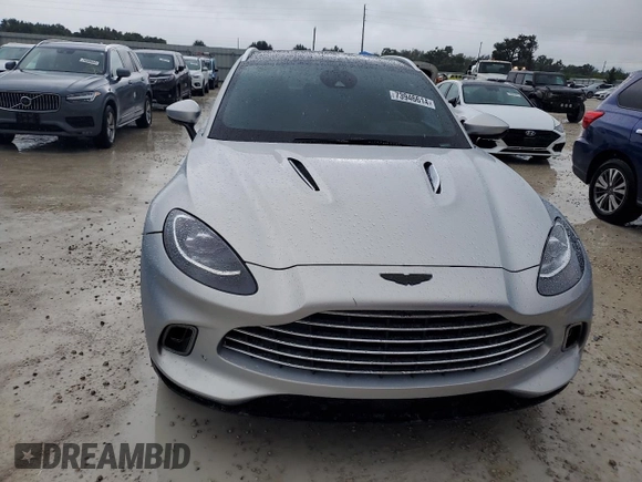 2021 Aston Martin DBX z VIN SCFVUJAW4MTV03930, wystawiony jako Copart lot #73946614 z przebiegiem Nie podano mil oraz Nie do naprawy. Historia ofert i sprzedaży dostępna na DreamBid. Obrazek 5.